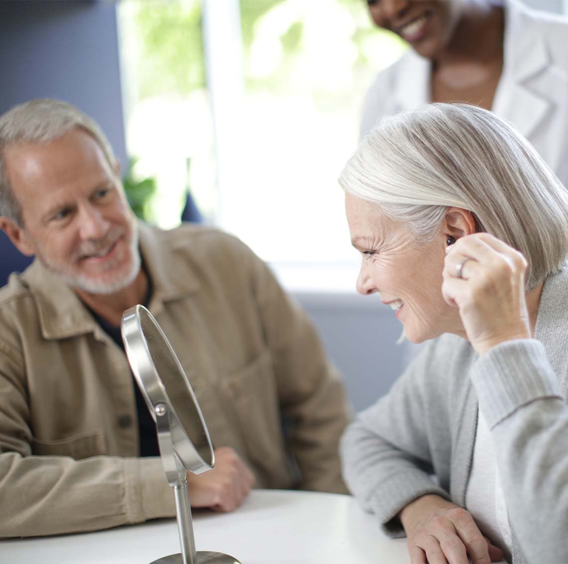 50-50-media-promo/Man_tapping_Hearing_Aid_wbst2815